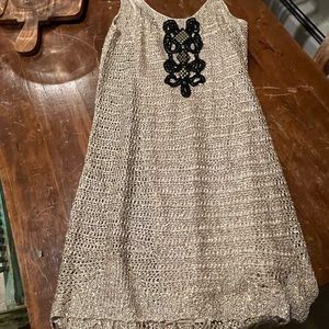 Size Small. Work twice good mini dress with embroidery and trim. So so cute on!